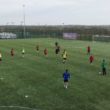 Footballers being coached during a training session