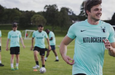 Man smiling during a football training session