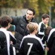 Bloomsbury Football players being coached