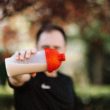 Man holding a protein shake