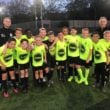 Kitlocker Juniors team photo with players and coaches.